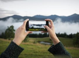 woman-taking-photo-rural-surroundings